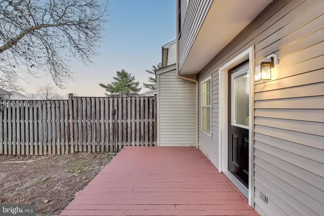 a view of a yard with a fence