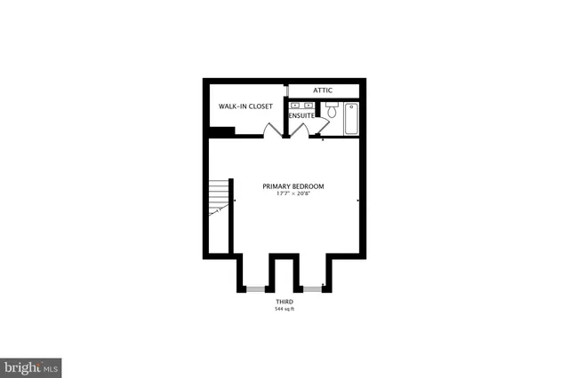 a view of a brick house with large windows