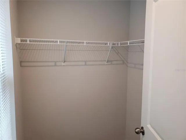 a view of an empty walk in closet