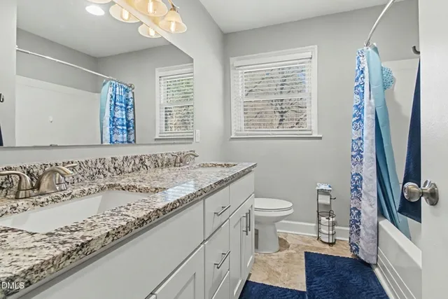 a view of a bathroom from the hallway