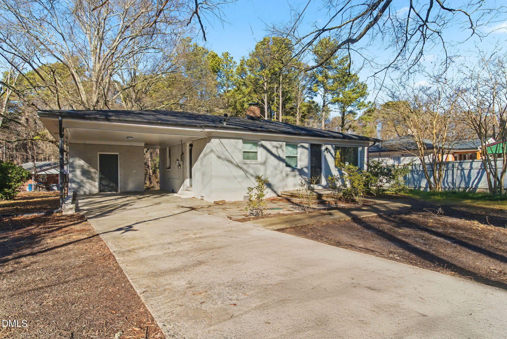 626 South Hoover Road Durham, NC 27703 - Photo 17 of 21 a view of a house with garden and trees