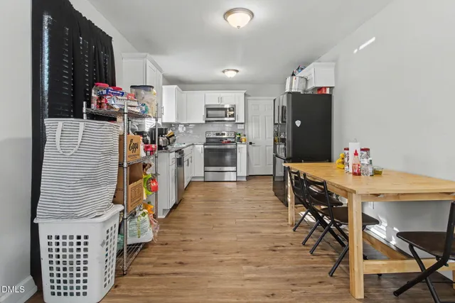 a view of a livingroom with furniture and a large window