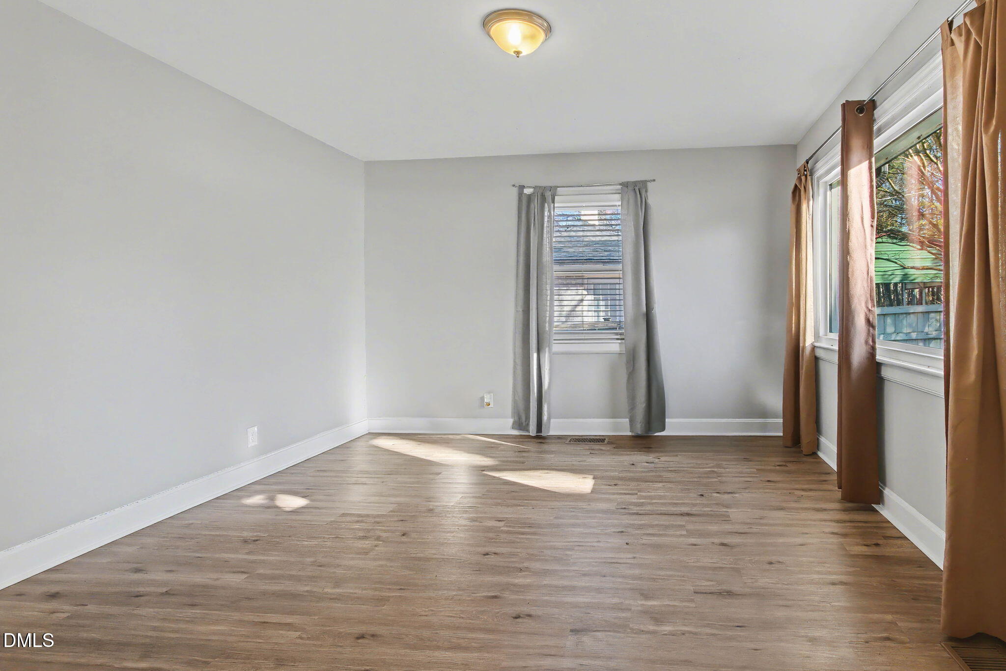 626 South Hoover Road Durham, NC 27703 - Photo 8 of 21 a view of empty room with wooden floor and fan