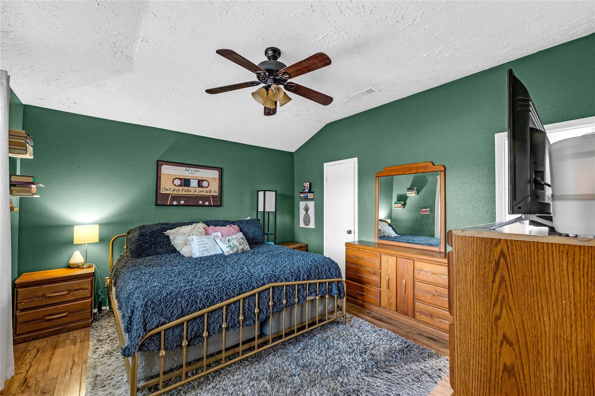 24014 Red Sky Drive Spring, TX 77373 - Photo 10 of 23 a bedroom with a bed and a dresser