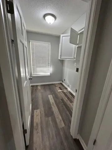a view of a hardwood floor in a room