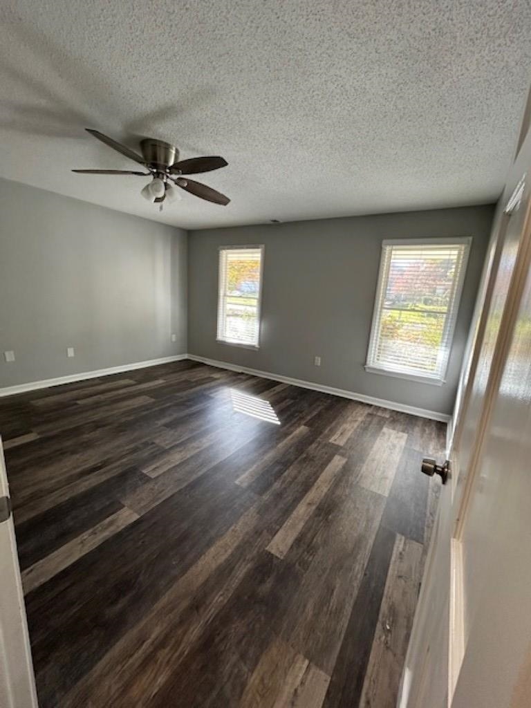 496 Quail Crest Drive Collierville, TN 38017 - Photo 8 of 23 wooden floor in an empty room with a window