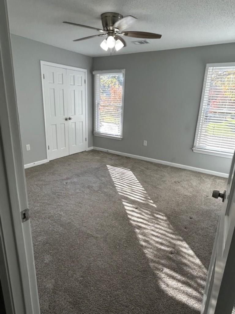 496 Quail Crest Drive Collierville, TN 38017 - Photo 10 of 23 an empty room with windows and fan