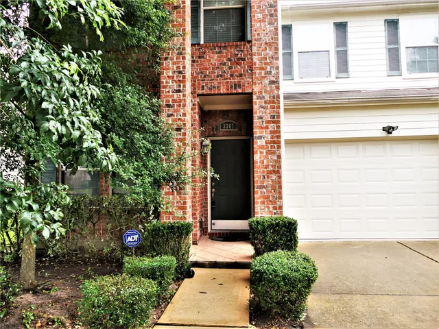 a front view of a house with a garage