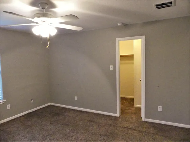 a view of a chandelier fan in a room