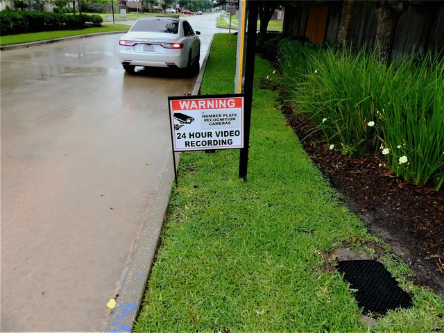 a view of a street with cars parked