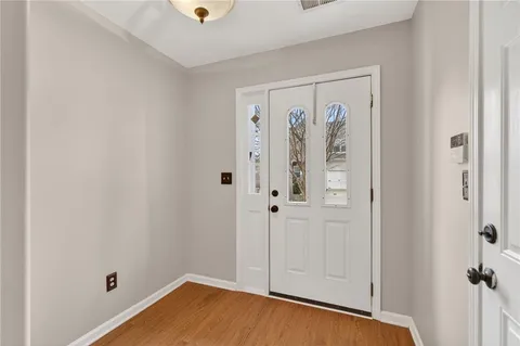 a view of a room with wooden floor and closet
