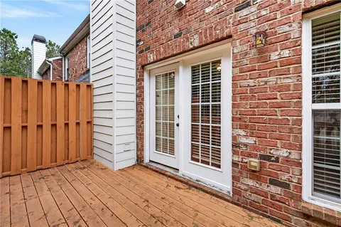 a view of a house with a door and wooden floor