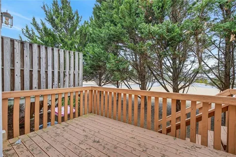 a wooden bench sitting in front of a building