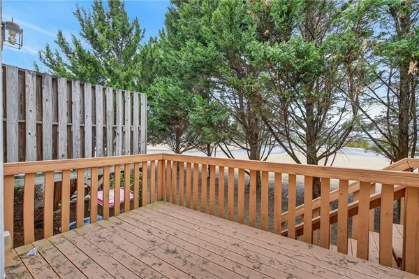 a wooden bench sitting in front of a building