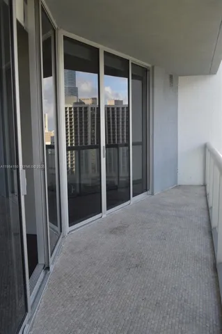 a view of gallery with floor to ceiling window