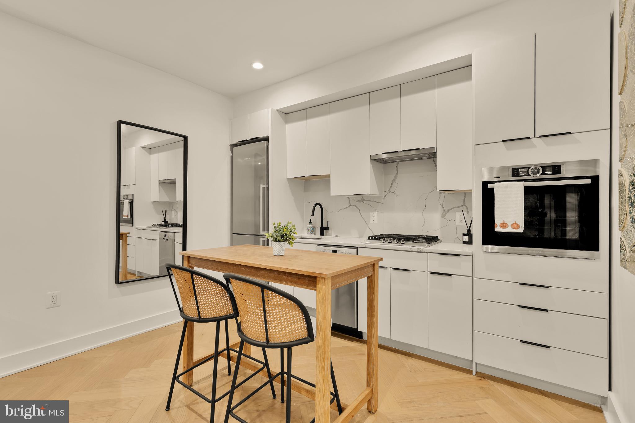 1225 11th Street Northwest, Unit 2 Washington, DC 20001 - Photo 14 of 20 Sleek modern kitchen with elegant design.