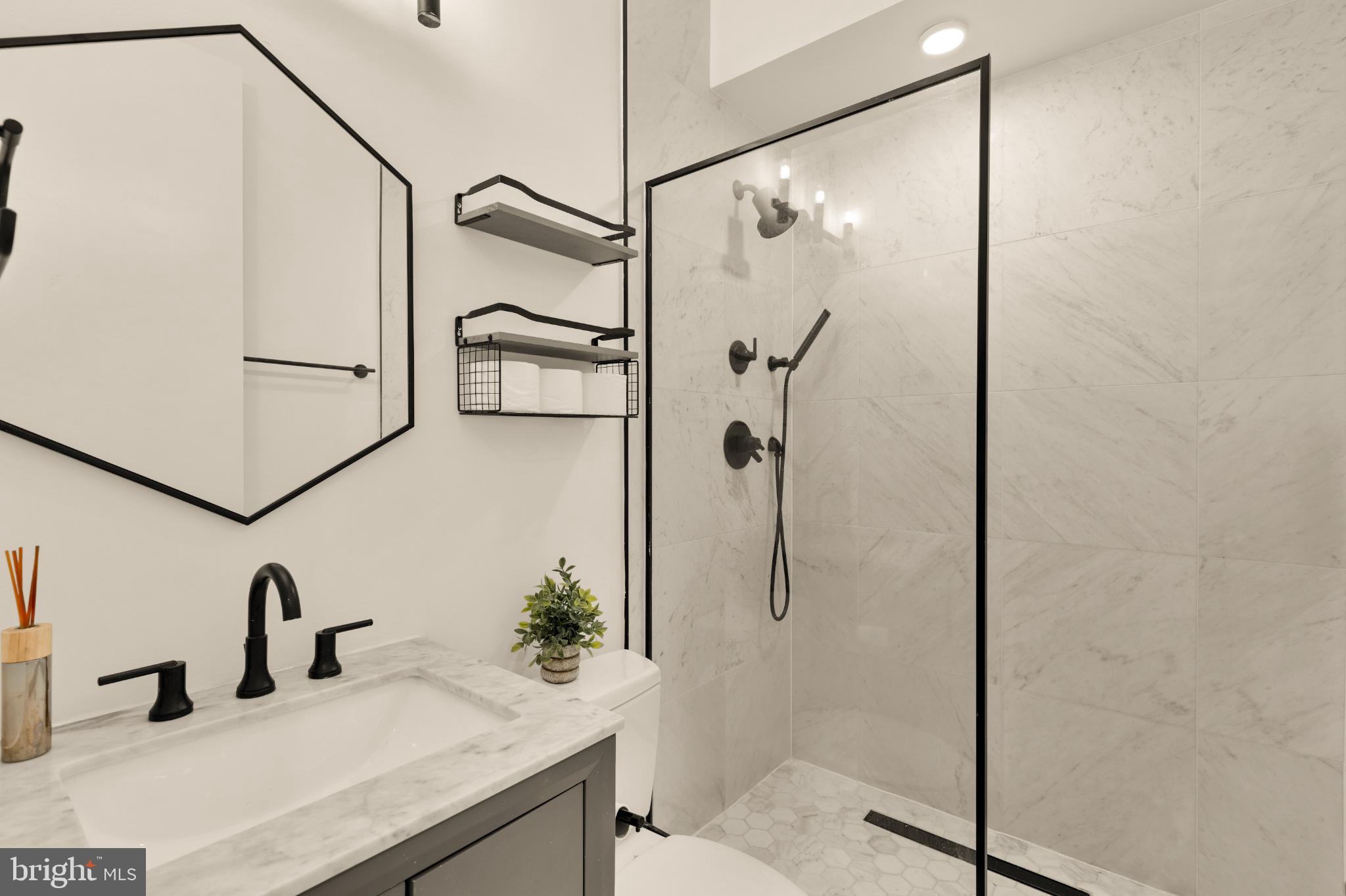 1225 11th Street Northwest, Unit 2 Washington, DC 20001 - Photo 19 of 20 Sleek modern bathroom with elegant finishes.