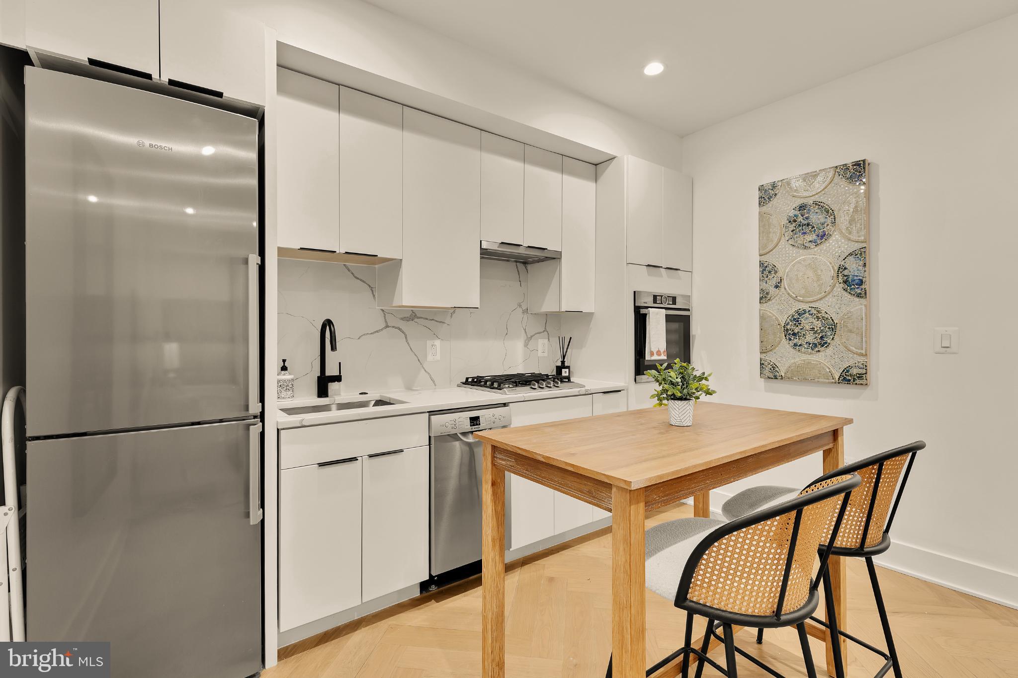 1225 11th Street Northwest, Unit 2 Washington, DC 20001 - Photo 10 of 20 Sleek modern kitchen with stylish accents.