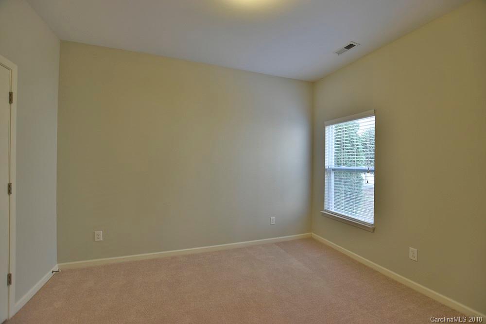 2328 Celandine Way Tega Cay, SC 29708 - Photo 12 of 15 an empty room with windows