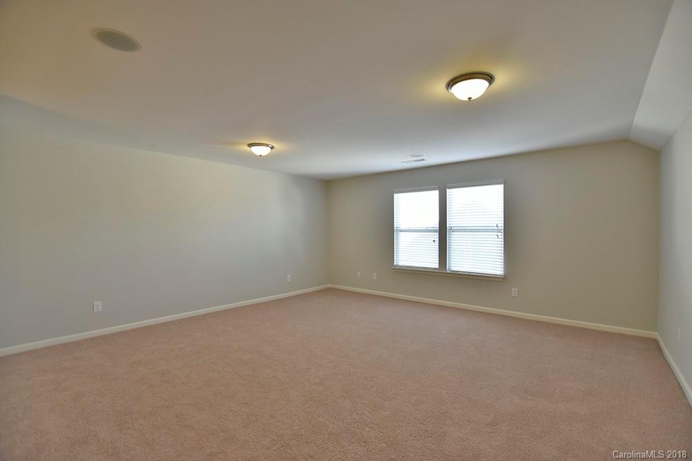 2328 Celandine Way Tega Cay, SC 29708 - Photo 13 of 15 an empty room with a empty space and a window