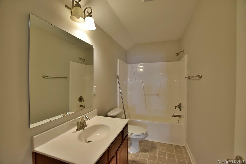 2328 Celandine Way Tega Cay, SC 29708 - Photo 14 of 15 a bathroom with a sink a toilet and shower