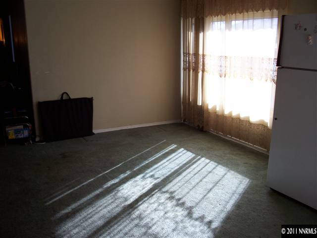 2688 Zinnia Avenue Reno, NV 89512 - Photo 6 of 6 a view of a room with wooden floor and windows
