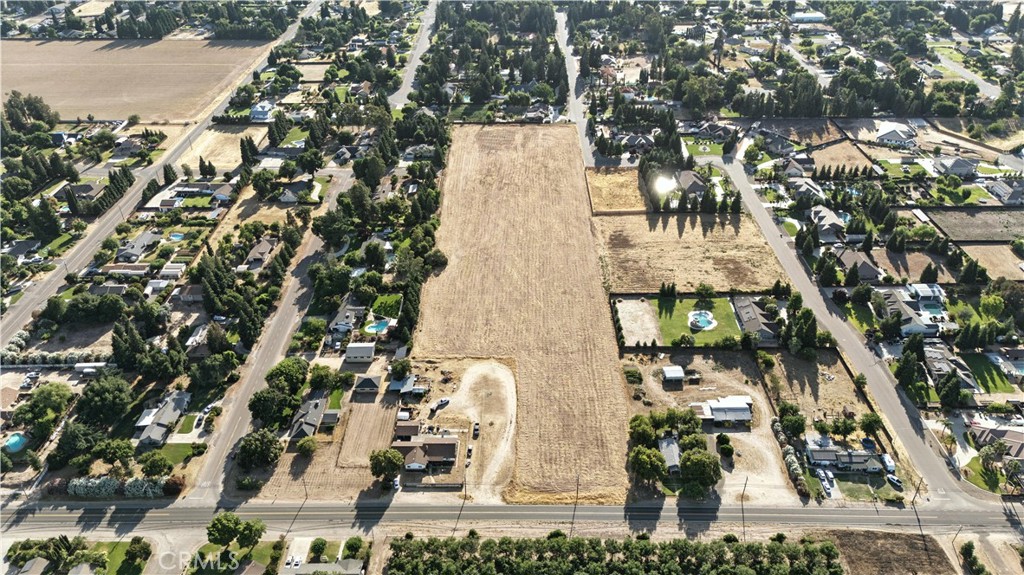0 North Buhach Road Atwater, CA 95301 - Photo 2 of 11 an aerial view of a residential apartment building with a yard and parking spaces