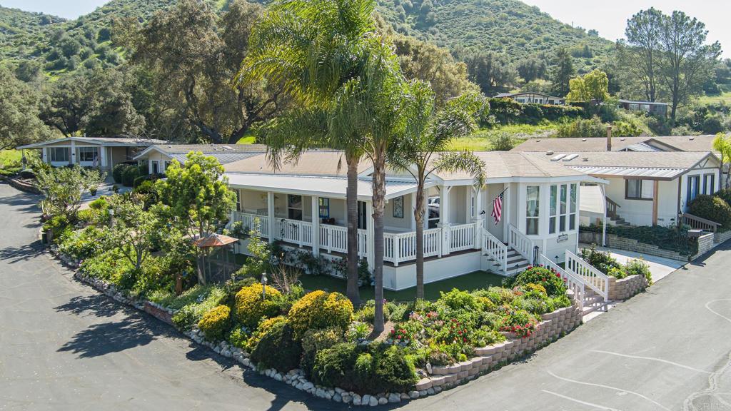 4650 Dulin Road, Unit 137 Fallbrook, CA 92003 - Photo 1 of 54 front view of a house with a yard