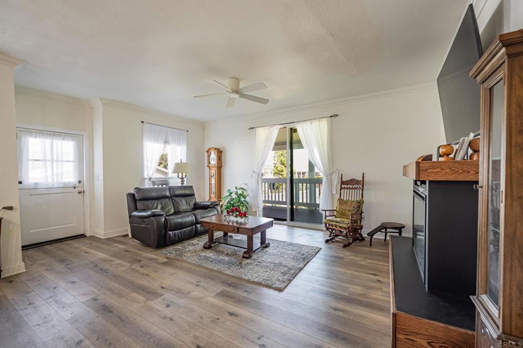 4650 Dulin Road, Unit 137 Fallbrook, CA 92003 - Photo 15 of 54 a living room with furniture and a large window