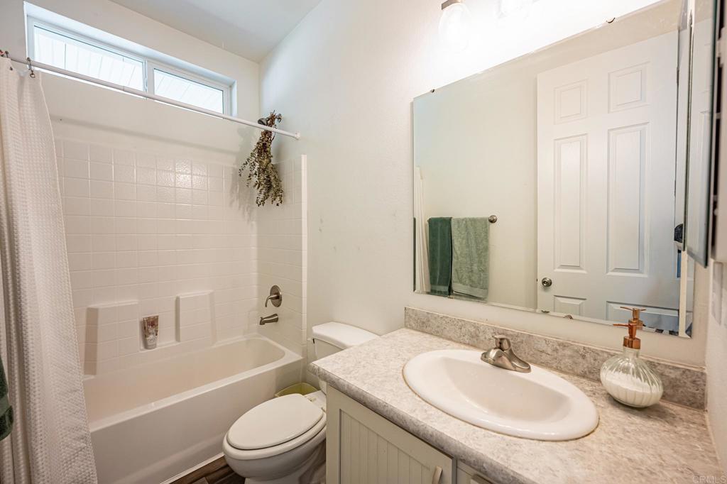 4650 Dulin Road, Unit 137 Fallbrook, CA 92003 - Photo 18 of 54 a bathroom with a sink toilet a mirror and shower
