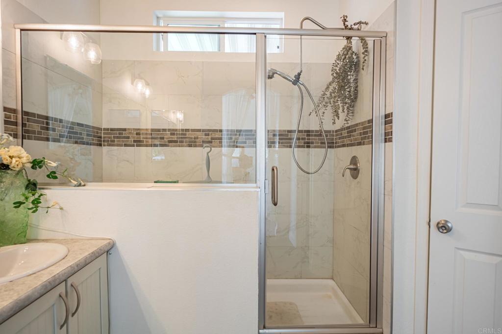 4650 Dulin Road, Unit 137 Fallbrook, CA 92003 - Photo 21 of 54 a bathroom with a shower and vanity