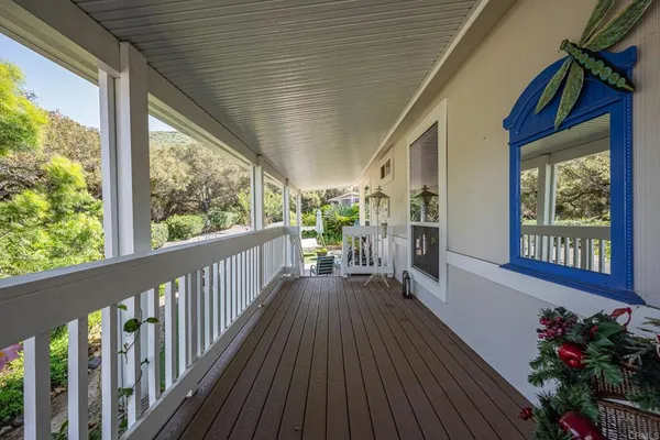 a view of a porch with wooden floor