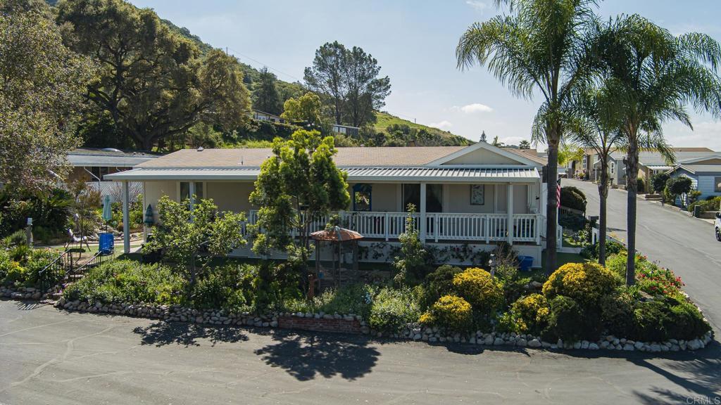 4650 Dulin Road, Unit 137 Fallbrook, CA 92003 - Photo 3 of 54 a front view of a house with garden