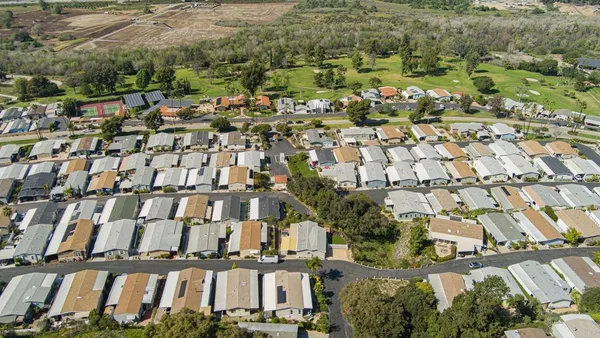 an aerial view of a house with a garden