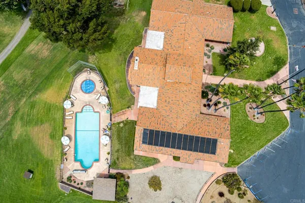 an aerial view of residential houses and outdoor space