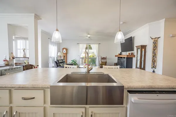 a kitchen with a stove a sink and a refrigerator