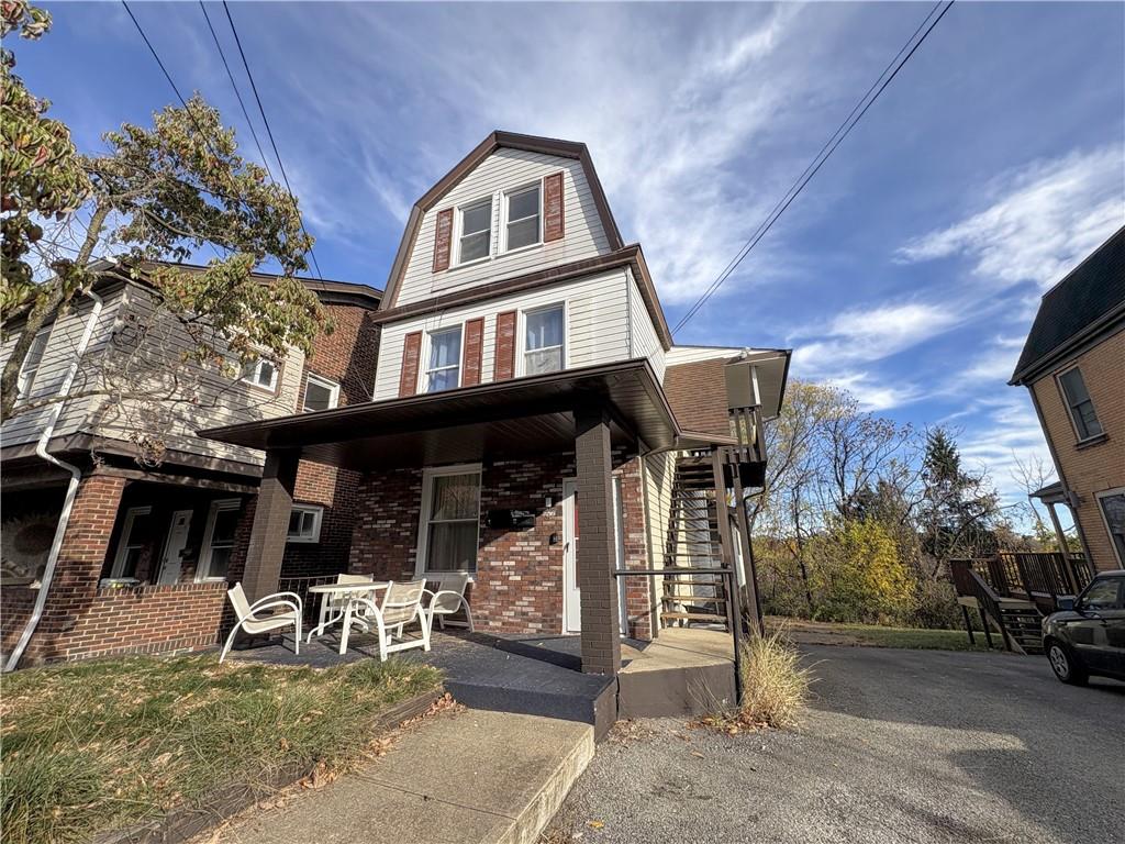 467 Oneida Street, Unit 2 Pittsburgh, PA 15211 - Photo 1 of 6 a front view of a house with a porch