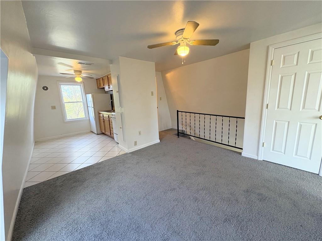 467 Oneida Street, Unit 2 Pittsburgh, PA 15211 - Photo 4 of 6 a view of empty room with a fan