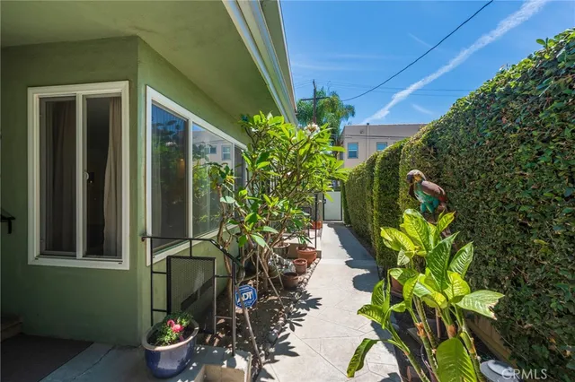 a view of backyard of house with outdoor seating