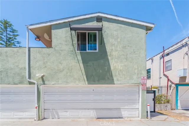 a view of a backyard with potted plants