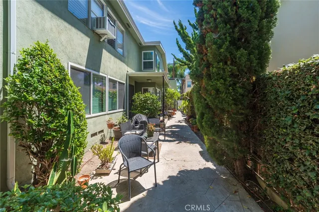 a vase of flowers sitting on a floor