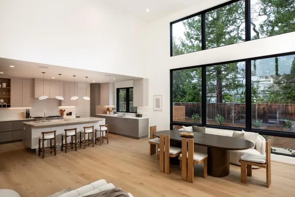 a bedroom with a bed and glass window