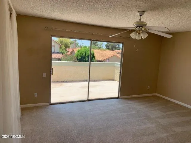 a view of room with window and air conditioner