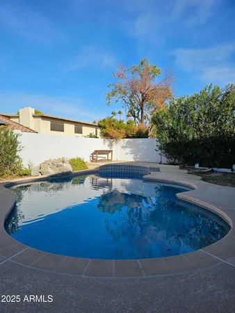a view of a swimming pool with an ocean view