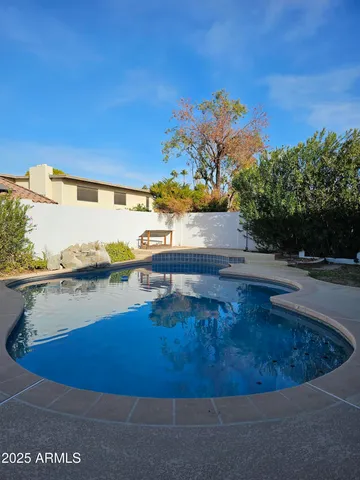 a view of a swimming pool with an ocean view
