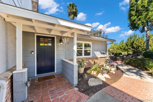 an aerial view of residential houses with outdoor space and swimming pool