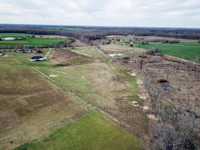 a view of a field with an outdoor space