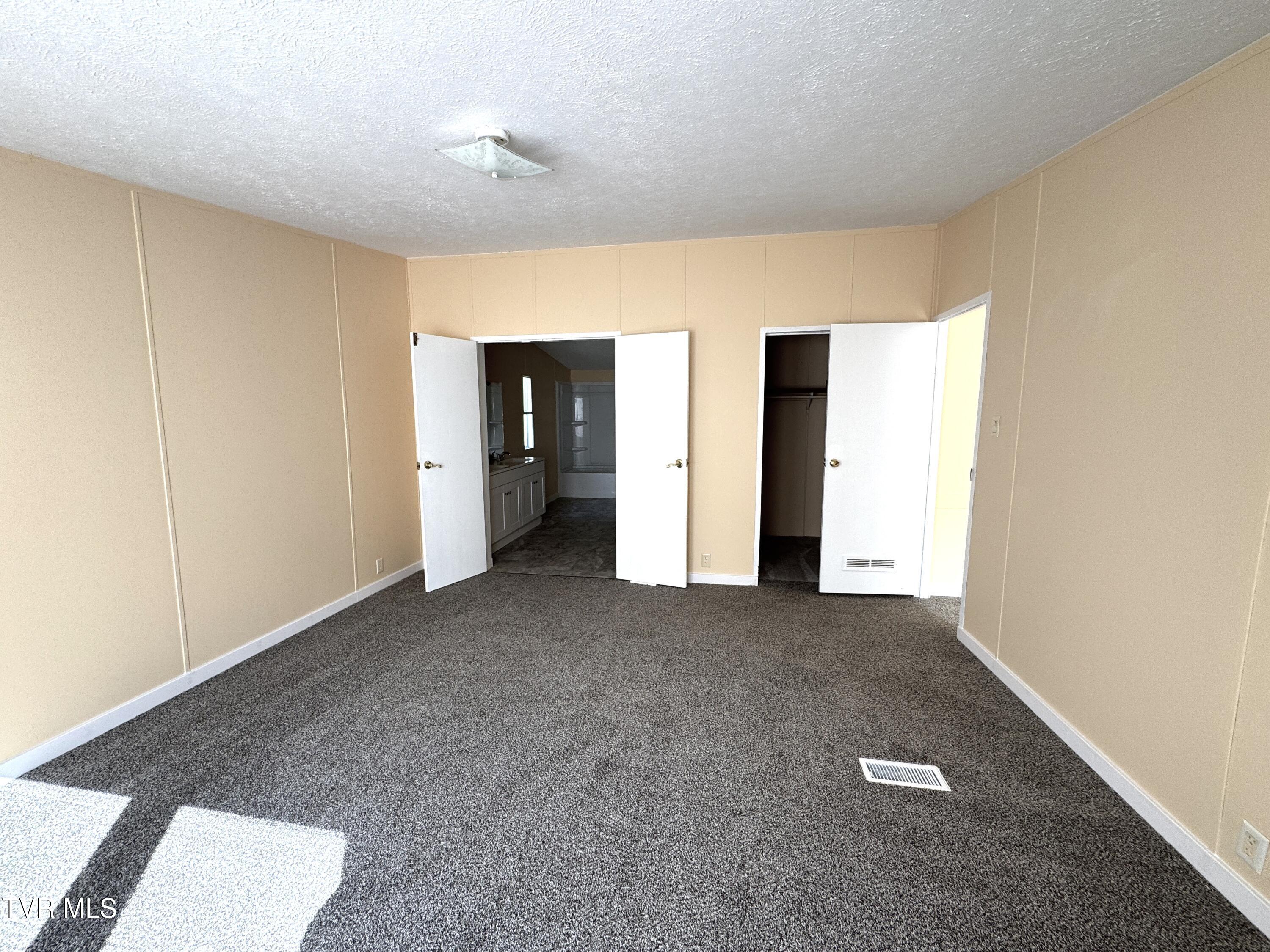 1555 Hamner Hollow Road Big Stone Gap, VA 24219 - Photo 15 of 41 MASTER BEDROOM TOWARD BATH AND WALK-IN C