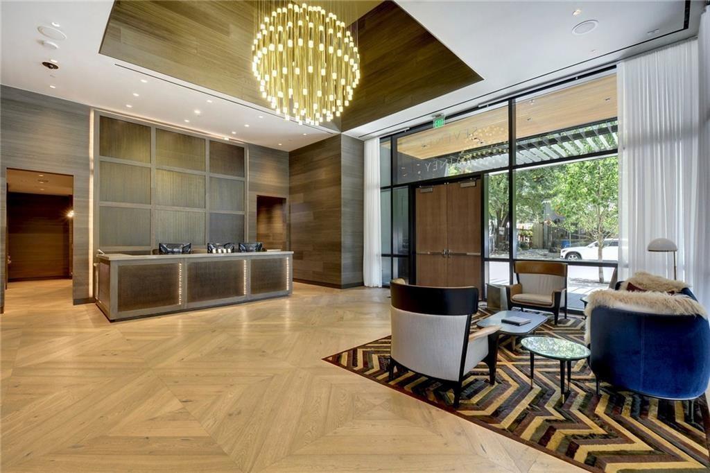 70 Rainey Street, Unit 1409 Austin, TX 78701 - Photo 25 of 38 Community lobby with expansive windows and recessed lighting