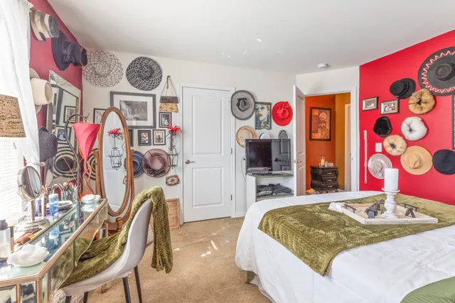 a bed room with a bed and a flat screen tv